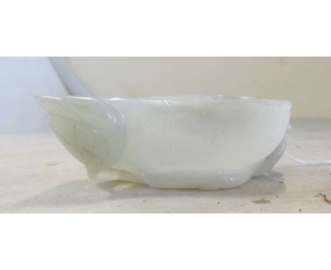 A Mutton Fat Jade Leaf dish on stand