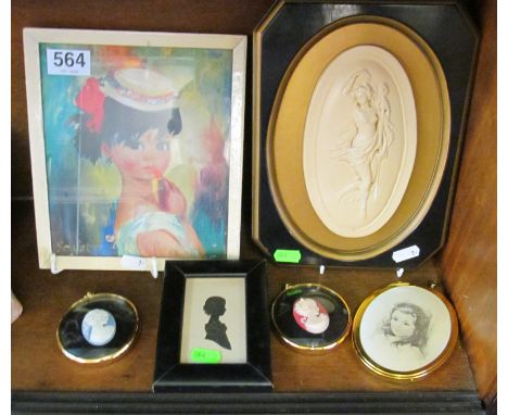 A silhouette young girl and other portrait plaques