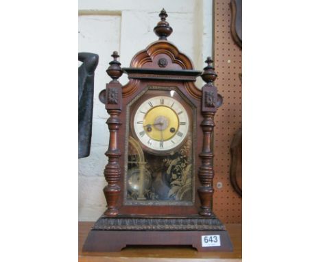 A Junghams oak cased architectural mantel clock, eight day movement striking on a bell