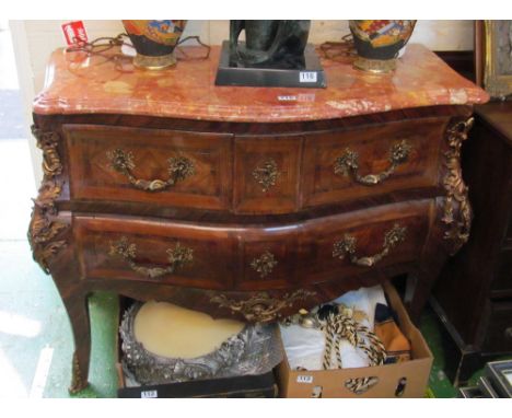 A reproduction French style serpentine fronted walnut veneered commode with gilt mounts and marble top and two drawers