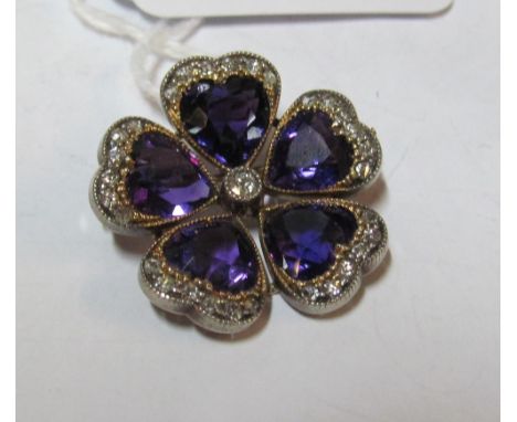 A pretty Edwardian diamond and amethyst flower brooch/pendant