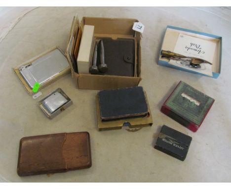 A chrome cigarette case and lighter, rifle spoon, bullet knife, cigar case, bibles et cetera