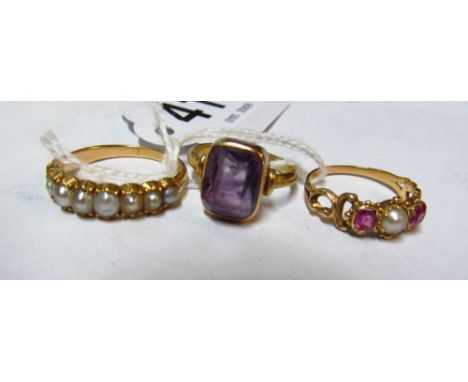 A gold coloured ring set graduated pearls, pearl and pink stone ring and amethyst ring 10.4gm