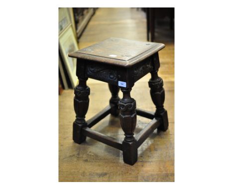 A 17th century style carved oak joint stool, 37 cm wide