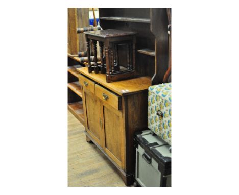 An oak dresser, 106 cm wide, a pine open bookcase, a trunk, a Chinese carved chest, a dressing chest, a pine table, chairs an
