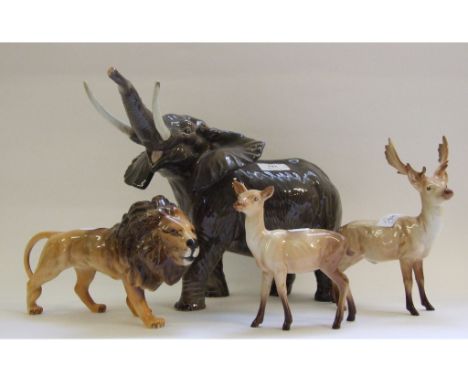 A Beswick Elephant, trunk stretching, large, 998, a Lion, facing right, 1506, a Stag, 981, and a Doe, 999A, all gloss (4) Con