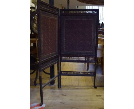 An Indian carved wood two fold screen, with tapestry panels, 124 cm high