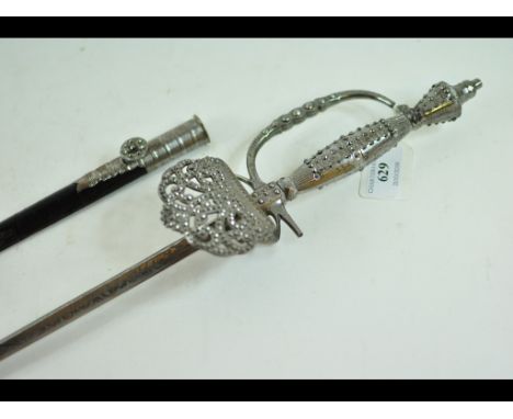 A court sword, the triangular shaped blade with engraved decoration and signed Marshall & Co, 57 & 58 Jermyn St SW, with a st