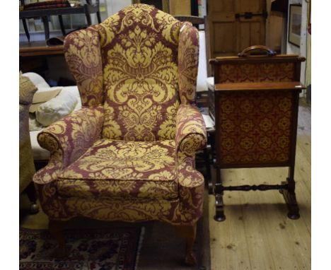 An 18th century style upholstered wing armchair, and a Victorian mahogany firescreen (2)