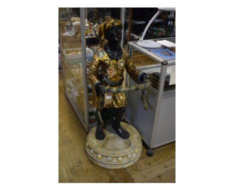 A Blackamoor style stick stand, with painted decoration, 122 cm wide Condition report Report by GHThis stick stand is made fr