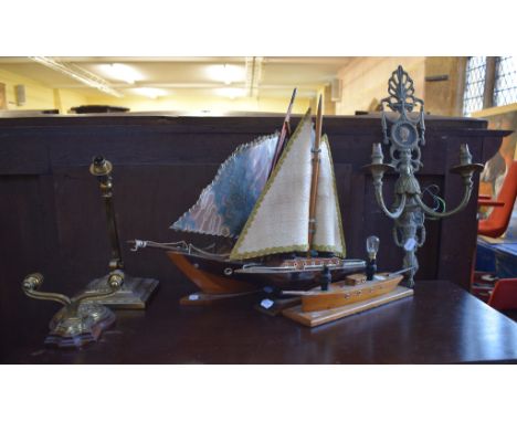 A novelty table lamp, in the form of a sailing ship, 49 cm long, two others similar, two pairs of metal wall sconces, and a t