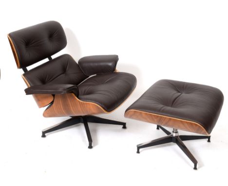 A Charles Eames style laminated and leather upholstered armchair, with a matching stool (2)  See illustration Condition repor