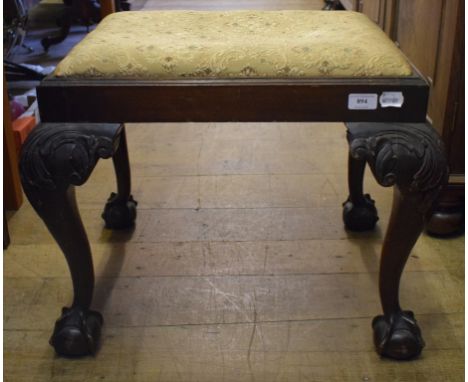 An 18th century style mahogany stool, on leaf carved cabriole legs with claw and ball feet