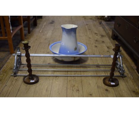 A pair of oak twist candlesticks, 32 cm high, a stainless steel hanging shelf, a wall bracket, a textile and other assorted i