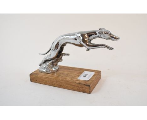 An accessory car mascot, in the form of a leaping greyhound, mounted on a plinth, 9 cm high