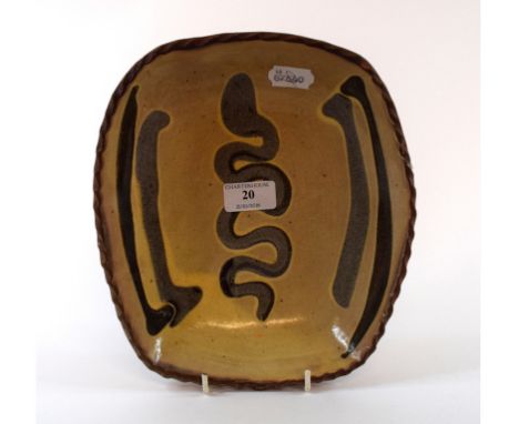 A Winchcombe pottery slipware dish, 25 cm wide