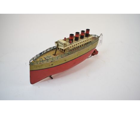 An early 20th century Arnold tinplate four funnel liner, with clockwork motor, and lithograph printed decoration, 30 cm wide