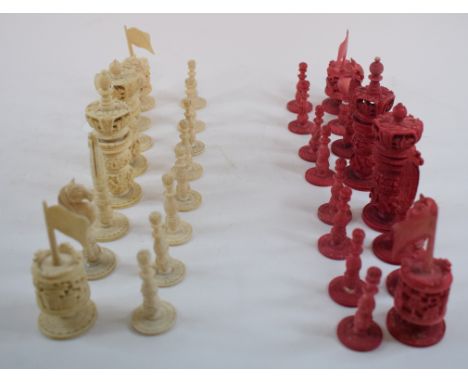 A stained and natural ivory chess set, the king 9.5 cm high 