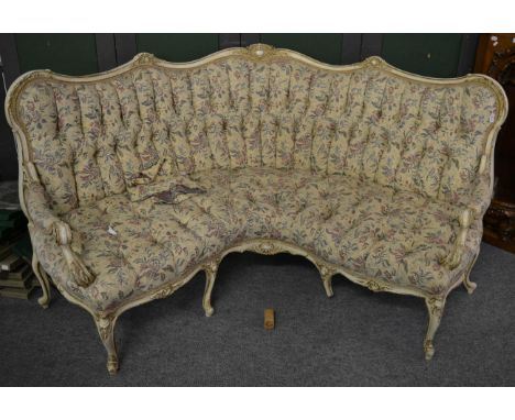 A 19th century white painted and parcel gilt corner sofa, in Louis XV style, recovered in cream, blue, pink and floral button