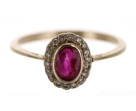 18ct yellow gold oval ruby and diamond cluster ring, the ruby 0.50ct approx, width 9mm, 2.3gm, ring size M/N (612) 