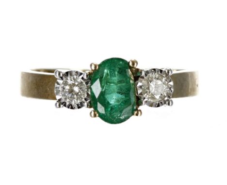 Emerald and diamond three stone 9ct yellow gold ring, the oval emerald&nbsp;0.50ct approx, flanked by two round brilliant-cut