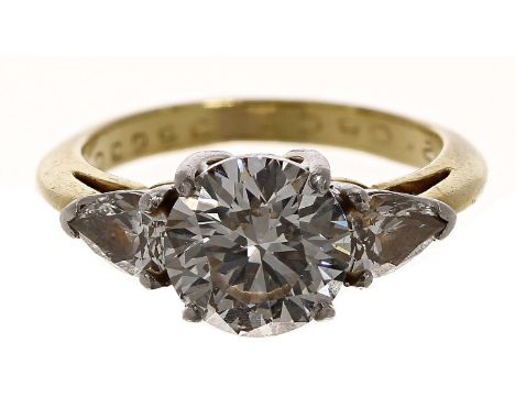 Tiffany &amp; Co. 18ct and platinum three stone diamond ring with a GIA certificate, the centre diamond round brilliant-cut,&