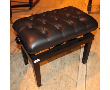 Piano Stool A concert adjustable duet stool with button upholstered leather top.