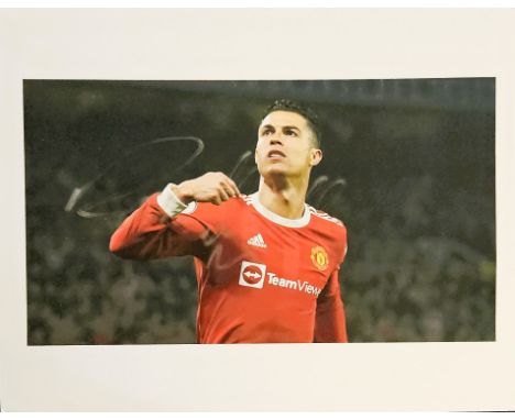 Cristiano Ronaldo signed 10x8inch colour photo. Pictured during his time with Manchester United.  Good condition. All autogra