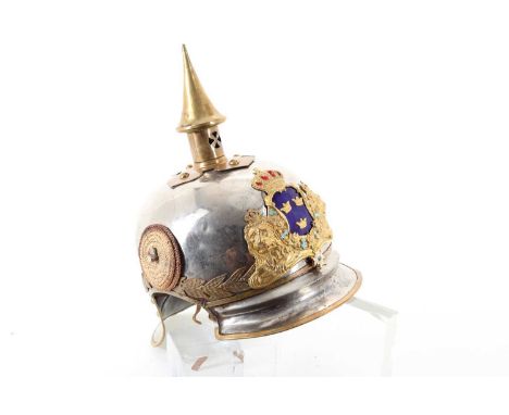 SWEDISH PICKELHAUBE HELMET, with brass spike, steel skull, enamelled and embossed gilt metal helmet plate and leather backed 
