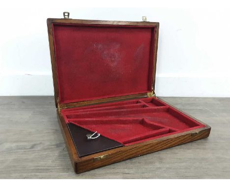 OAK PISTOL CASE, to fit a 1851 Navy Colt .36 pistol, with red baize interior, along with a powder flask and conical bulletsAd