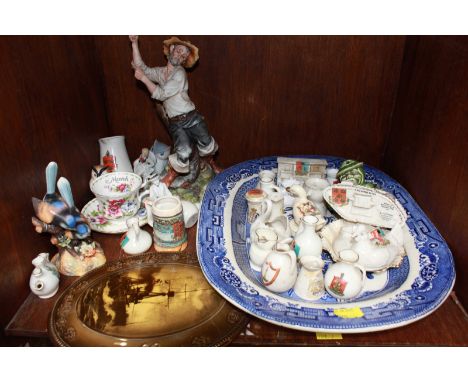 SECTION 50. A shelf of assorted ceramics including crested ware and a WWI tank, a blue and white meat plate, a Crown Derby Wr