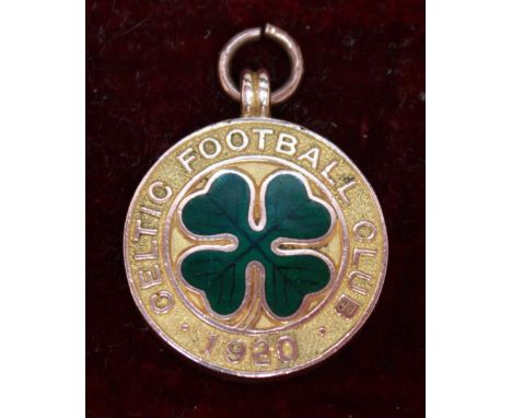 A 9ct gold and enamel 1920 Celtic Football Club medal, decorated with a green enamel four leaf clover.  Hallmarked Birmingham
