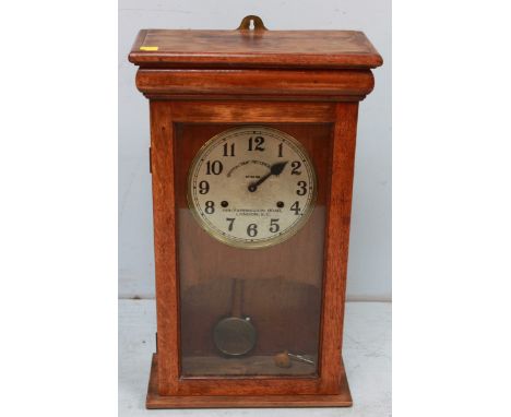 A 1930s oak cased Betar British Time Recorder clock, the circular silvered dial with Arabic numerals. 44.5 wide, 76.5 cm high