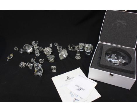A collection of Swarovski cut crystal animals, together with a Swarovski model sailing ship in box.
