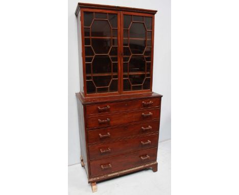 A 19th century mahogany secretaire chest, with hinged top drawer enclosing drawers and pigeonholes, above three further gradu