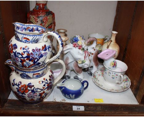 SECTION 24. A shelf of assorted ceramics including a set of three Victorian graduated jugs, a Japanese vase and other items.