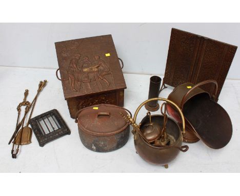 A quantity of brass and copper items including a fire screen, fire side tools, buckets and a coal scuttle with embossed scene