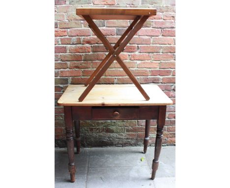 A Victorian pine kitchen table, the plain top over a single drawer and supported on stained pine turned legs. 91 cm long, and