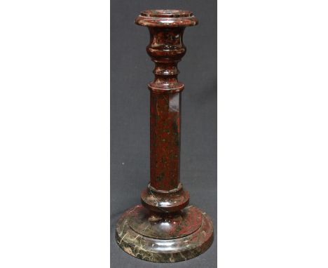 An Italian red and green marble candlestick. 29.5 cm high.