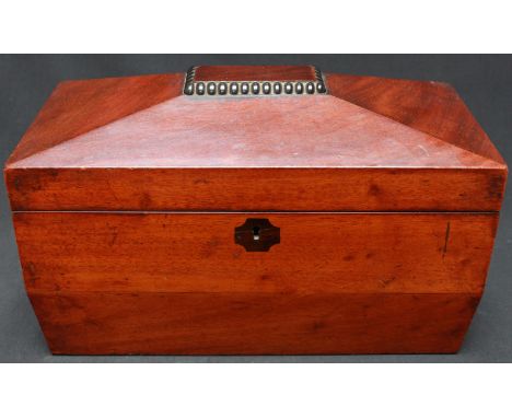 A 19th century mahogany sarcophagus shaped tea caddy, with two internal lidded compartments and central well. 31 cm wide.