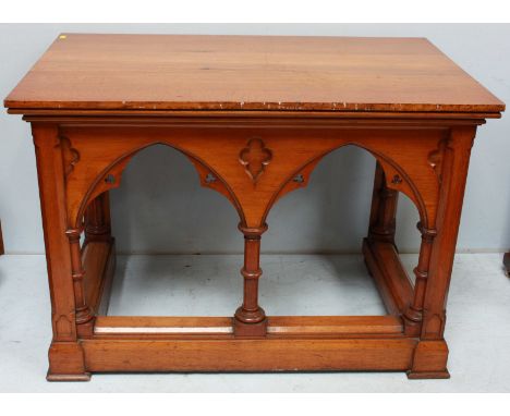 A 19th century light oak church alter table in the gothic reformist "style" of rectangular form, three sides with open gothic
