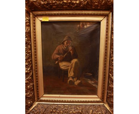 Late 19th/early 20th Century school, interior scene of a man in fisherman's hat and clogs, smoking a pipe, indistinctly signe