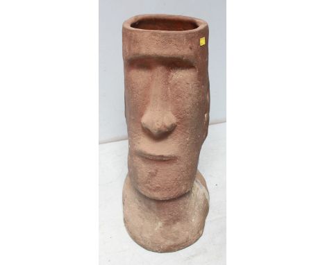 A terracotta Easter Island Moai head stick stand. 69 cm high.