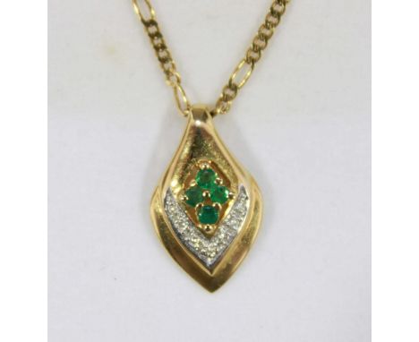 An 18ct gold, diamond and emerald drop pendant, set with four emeralds above a diamond chevron, on an 18ct gold Figaro chain.