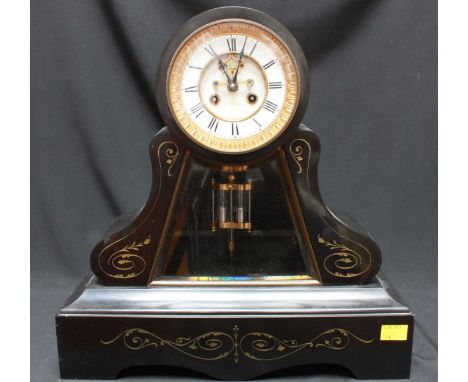 A large Victorian black mantle clock, with drum shaped movement above a scrolled case with bevelled glass plate and mercury p