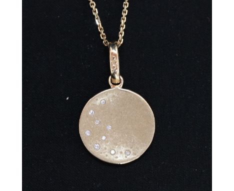 An 18ct gold Links of London diamond set disc pendant and chain, with signature logo fastening