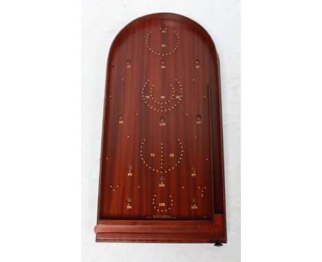 A boxed Bagatelle board, unused, complete with balls.