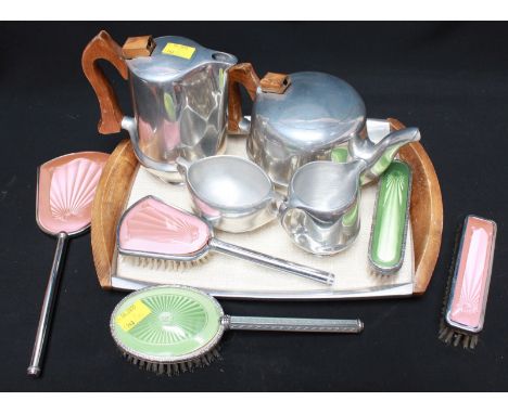A Piquot Ware five-piece stainless steel tea set including tray, together with a 1930s guilloche enamel-backed brush and mirr