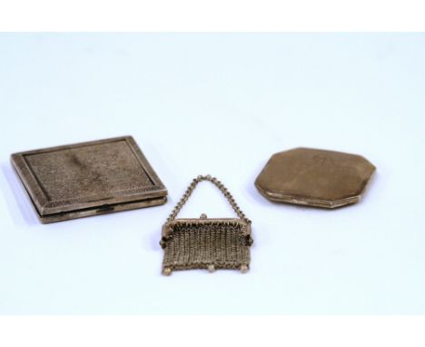An Art Deco silver compact, Birmingham 1952, with engine turned decoration engraved 'Mary 18/2/62', 6.5cm x 6.5cm; a white me