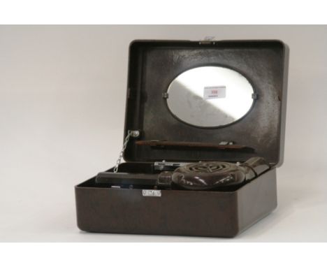 A Bakelite cased vanity set, containing comb and hairdryer - sold as collector's item 